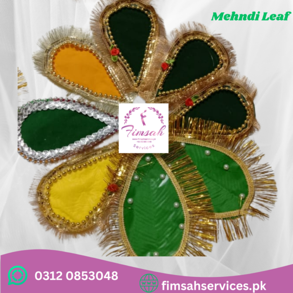 Close-up image of a bride's hand holding dried Rasam Patta Leaves.